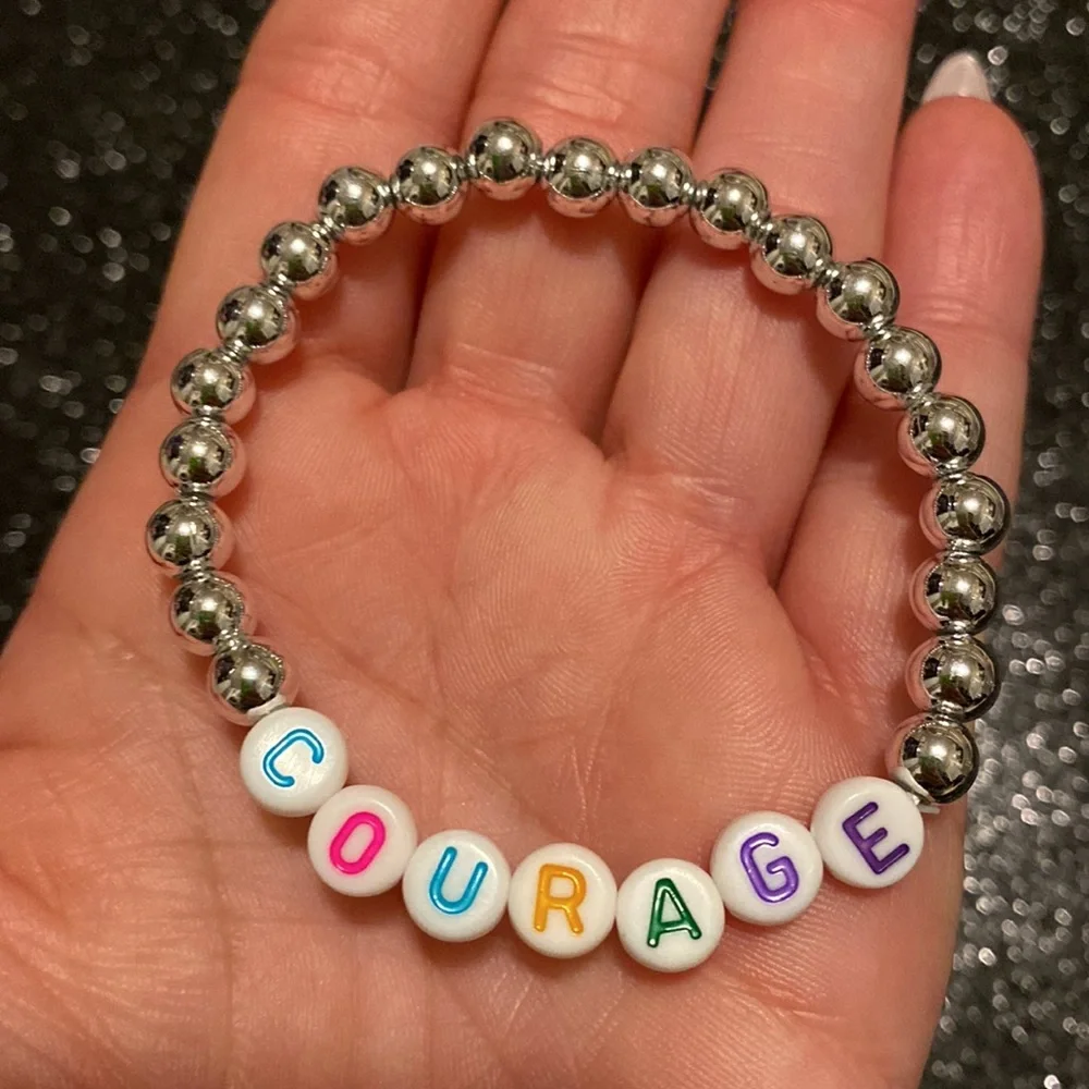Girls faux silver beaded stretch courage bracelet